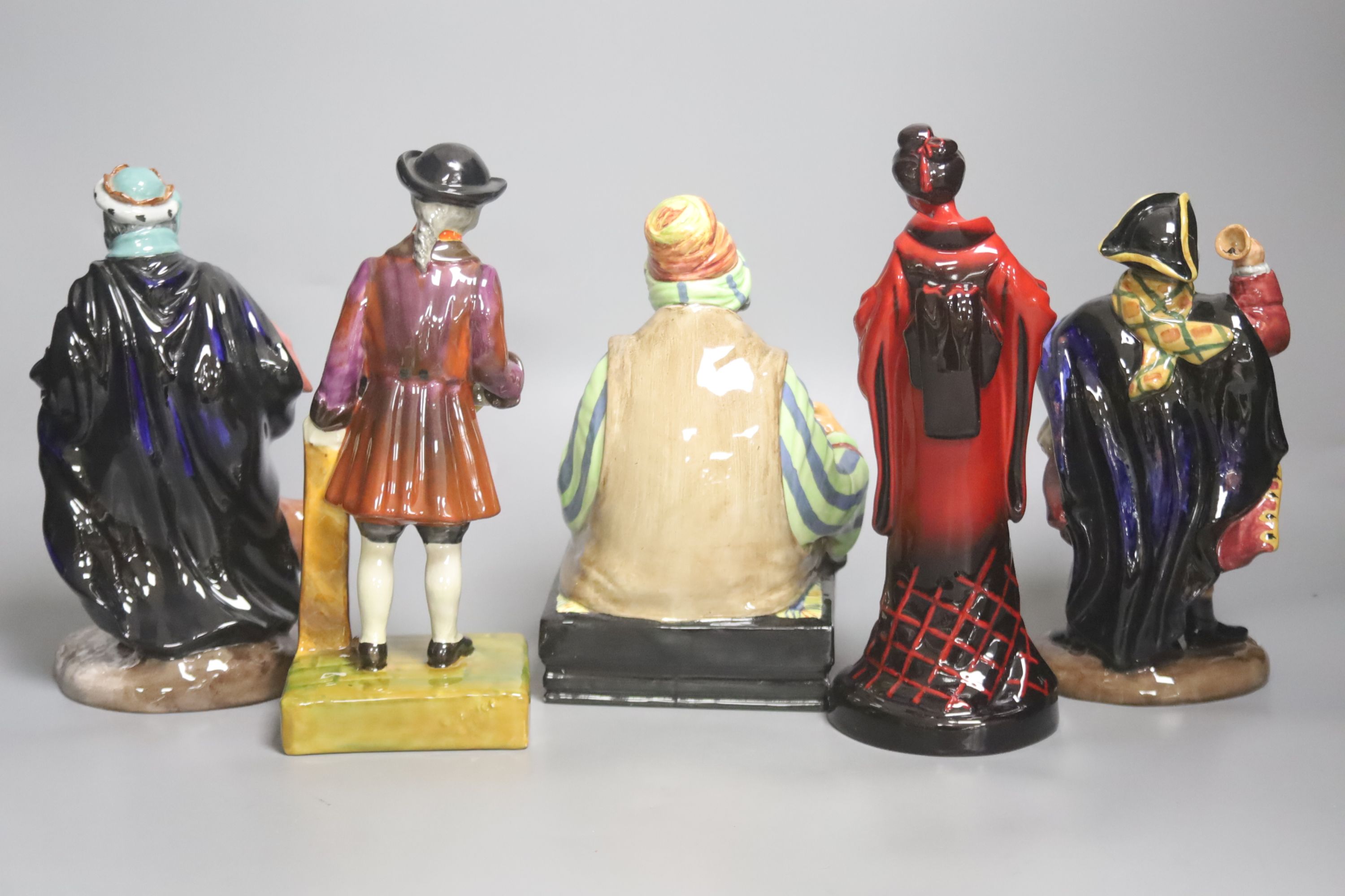 kRoyal Doulton figures: Town Crier HN2119, Cobbler HN1706, Good King Wenceslas HN2118, The Geisha and a Royal Staffordshire figure 'Penny Pins', tallest 24cm high